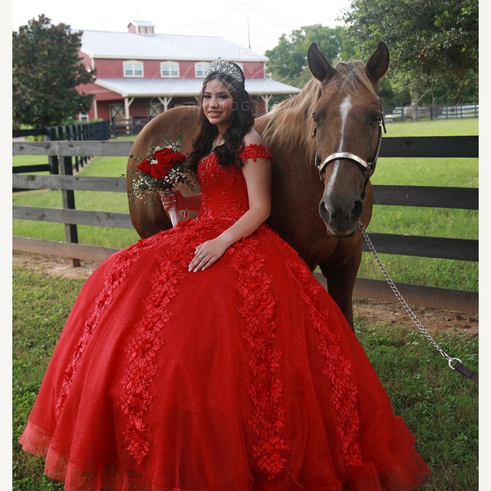 Red quinceñera dress with crown.